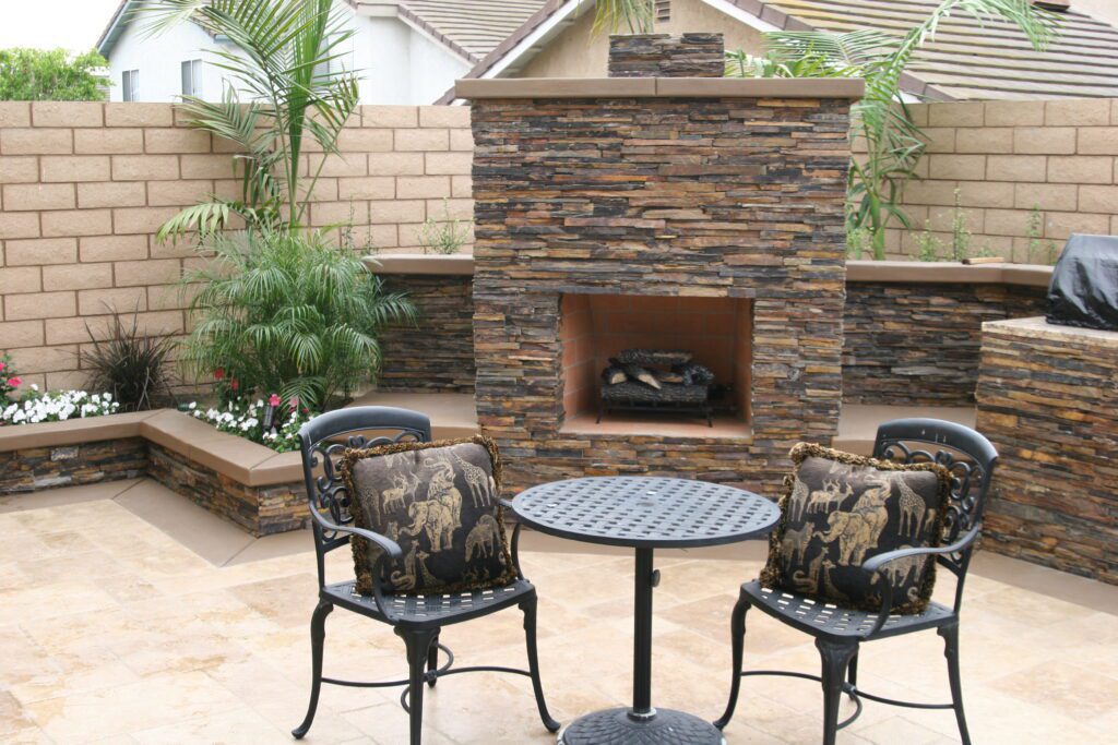 Outdoor sitting area with a fireplace