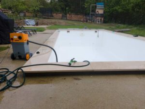 Pool Plastering service Drone flight over pool in the middle of greenery just left out and cleaned