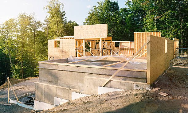 Residential construction site panorama with concrete pool in the foreground, highlighting pool construction in Eastvale, CA.